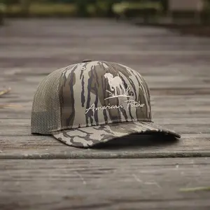 American Fetcher Camo Trucker Hat – Woodland Camouflage with Dog and Grass Logo Embroidery, Mesh Back, Adjustable Fit, Perfect for Outdoor Adventures