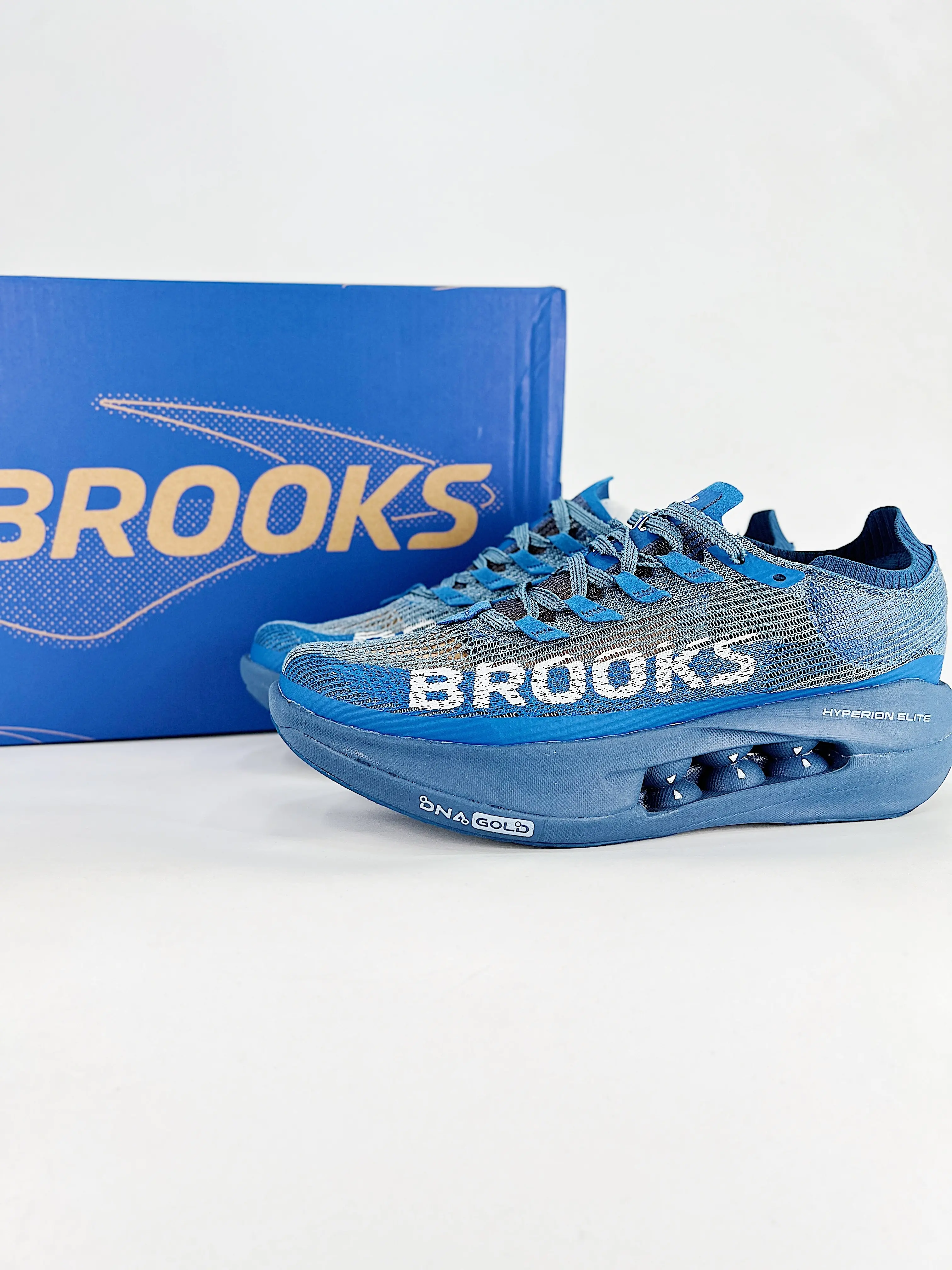 Low-top athletic trainers perfect for long run training & casual outdoor commutes, ultra-light breathable woven mesh grey blue silhouette, full upper airflow channels, tough textured rubber outsole boosts traction on asphalt and trail surfaces