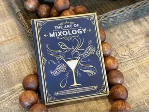 The Art of Mixology: Classic Cocktails and Curious Concoctions Hardcover