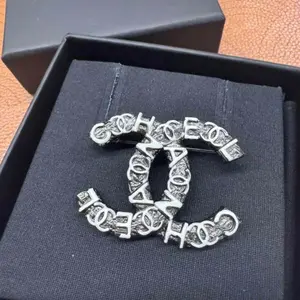 Pre-owned Chanel Dark Silver Tone Black and White Enamel Graffiti Letter CC Logo Brooch Pin JLP020516