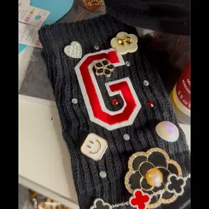 Junk Socks - Black Knit Socks with Heart, Letter G, and Flower Designs - Womenswear Comfort, Starting Price $40, Available in Various Colors
