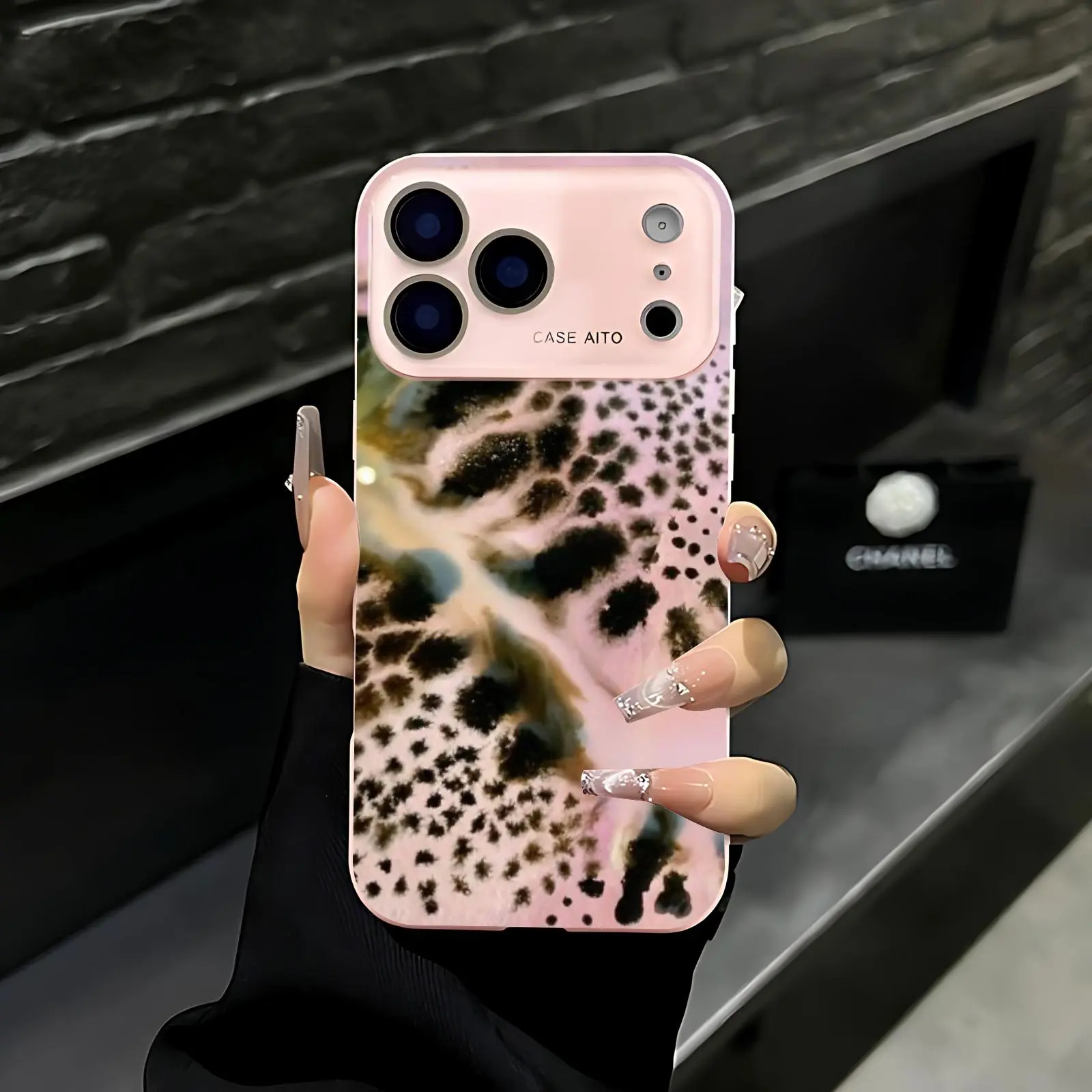 Pink leopard print phone case. Compatible with iPhone 17 Pro Max, 16 Pro Max, 15 Pro Max, and 14 Pro Max. Offers shock resistance and full lens protection. Also compatible with iPhone 15, 14, 13, and 12. Made of skin-friendly TPU material.