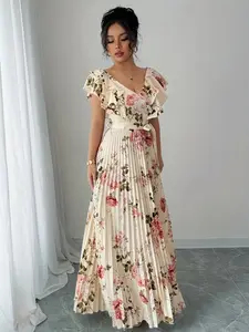 A women's apricot colored fashionable Floral rose print pleated long dress, with a gentle print and a flowing pleated skirt suitable for commuting to work, shopping and outdoor activities, indoor and outdoor dressing