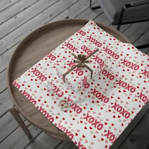Glittery XOXO Wrapping Paper with Red Hearts for Romantic Gifts