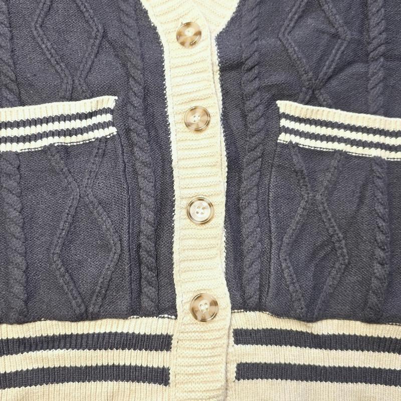 Preppy Cable Knit Varsity Cardigan  Textured cable knit cardigan with contrast varsity-inspired trim.