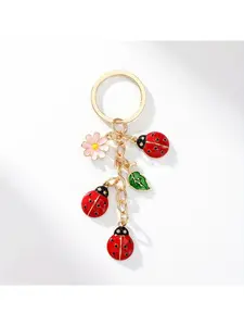 1 seashell alloy keychain. A lovely seashell dripping oil on a flower, a popular decorative pendant for bags and gifts.