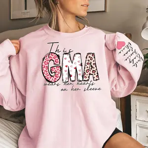 Custom This GMA Wears Her Heart On Her Sleeve Sweatshirt, Personalized Mom With Kids Names Apparel, Motherhood Hoodie, Mother's Day Gifts