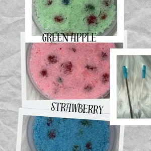 Three 8oz containers of our Sour Dour Bites Gusher Sour Blue Raspberry Strawberry Green Apple Snack Variety Pack with light blue sour dour hand