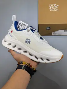 Obsessed with this crisp white running sneaker with bold blue accents, ultra-lightweight mesh for workouts and streetwear