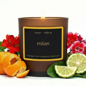 JoeJo + Nebria “Milan” — A coconut-apricot wax candle with mandarin rind, bergamot, and geranium. Bright, green, and citrus-forward. Comes in a vegan, reusable container for reuse.