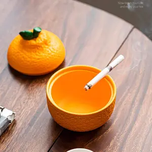 🍊This orange ashtray is chef's kiss! The lid keeps ash contained + it brings good luck vibes—works as both an ashtray and a cute decor for home/office!