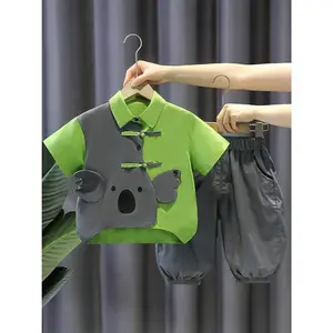 A Outfit Kids Consisting of a Short-Sleeve Top And Fitted Pants, Designed in Two with Koala Motifs And a Button Style Reminiscent of Chinese Fashion, Outdoor