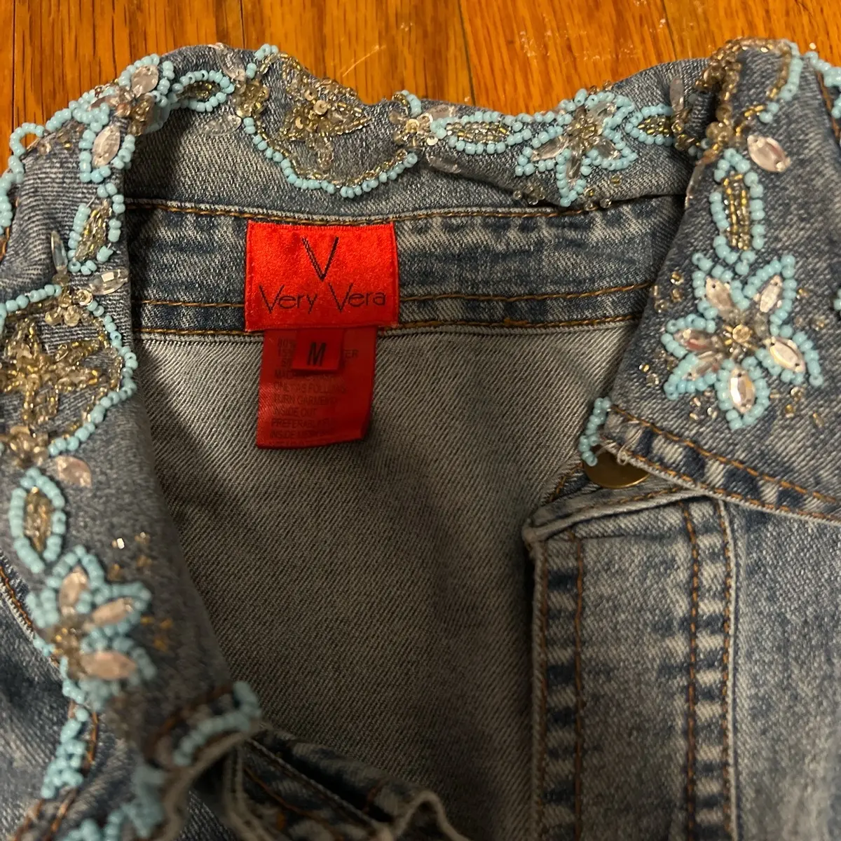 Very Vera blue Jean jacket with blue beaded design on it super cute it is button up as well