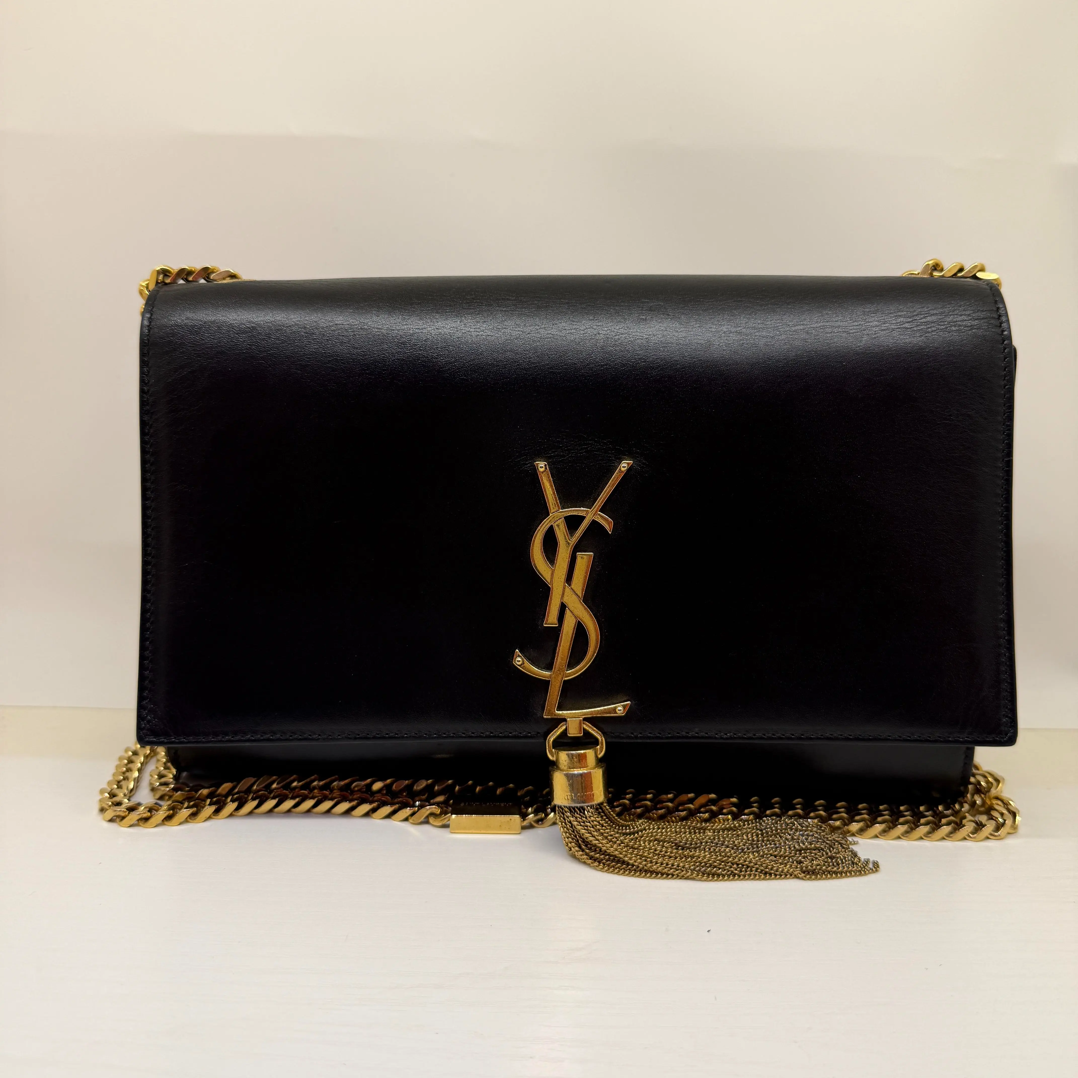 Pre-owned Yves Saint Laurent Saint Laurent Kate Medium Tassel Bag in Black Smooth Calfskin with Gold Hardware & Magnetic Closure