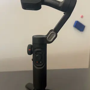 Product Review of Handheld 3 Axis Anti-shake Shooting Stand (1 Count), Rotating Automatic Face Tracking Tripod Stabilizer for Live Video, Phone Accessories, Content Creator Tools from I**s