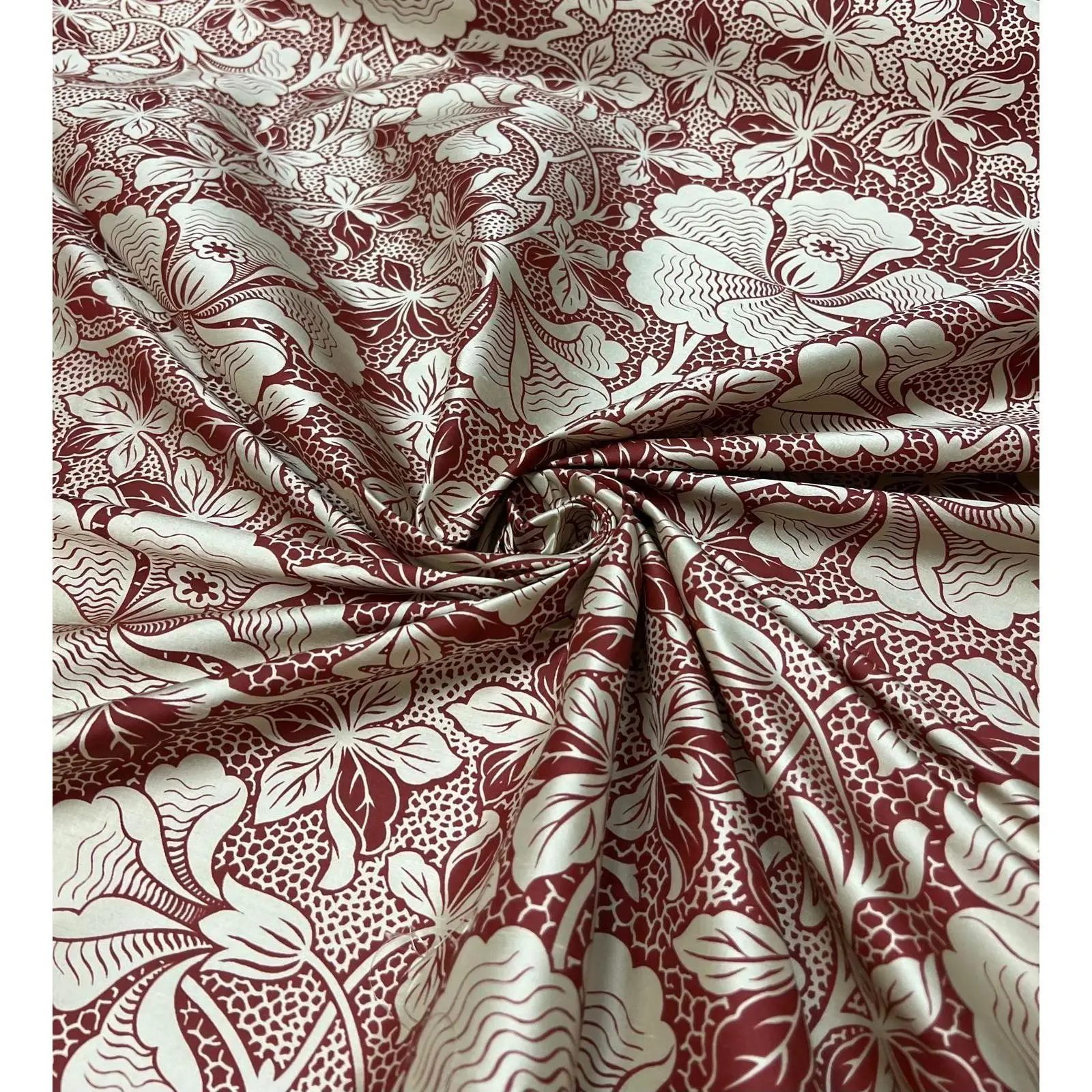 Silk floral  print in mehroon and ivory color print on silk Shantung ,  54” wide fabric. Sold by the yard.