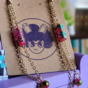 Dangle Pink Bead Earrings On a Gold Chain