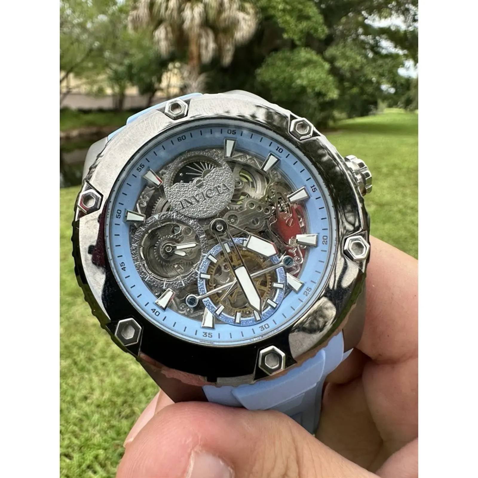 Invicta Akula 42766 Automatic Men's Watch with Skeleton Dial, 52mm Gunmetal Stainless Steel Case, Blue Silicone Strap, Water Resistant, Flame Fusion Crystal, Exhibition Case Back