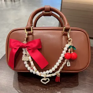 Fashion bow cherry handbag bag hanging chain Internet celebrity explosion creative exquisite luggage pendant cross-border wholesale women