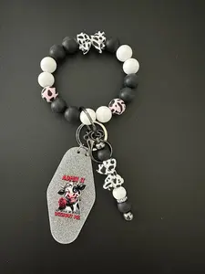 Wristlet keychain bundle that includes wristlet, beaded keychain and hotel keychain