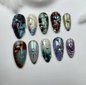 Galaxy Armor Press-On Nails – Iridescent metallic set with sci-fi textures, silver studs, 3D chrome lines & futuristic aura vibes.