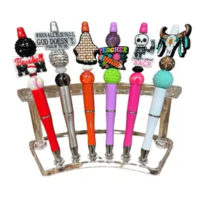 Pen Claims in Live - Unique Collection of Pens with Various Designs and Messages Displayed in a Rack