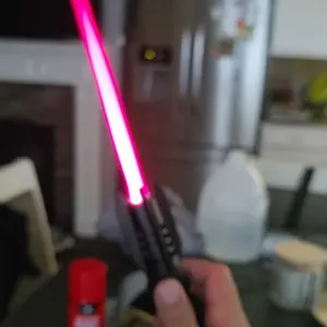 A light saber-shaped butane gas lighter, camping barbecue welding supplies, red flame (excluding butane gas) fire pit Kitchen Utensils Lightweight Powerful  Light Saber Wind Turbine Lighter outdoor windproof rechargeable butane lighter Decor Ornaments