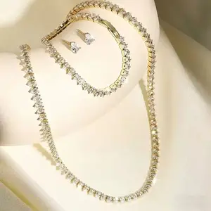 Elegant waterdrop-cut zircon jewelry set for women, a three-piece collection including a full-diamond necklace, bracelet and earrings. Designed for banquets, weddings and birthday gifting, creating eye-catching light luxury accessories.