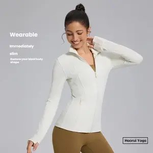 Women’s full-zip athletic jacket featuring a waist-cinching slim fit with biomimicry fishbone lining that contours curves; yoga jacket with thumbhole closure; suitable for everyday gym wear and running training.