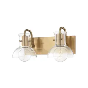 Riley 2-Light Vanity Light with Clear Glass Bell Shade in Polished Nickel or Aged Brass Finish