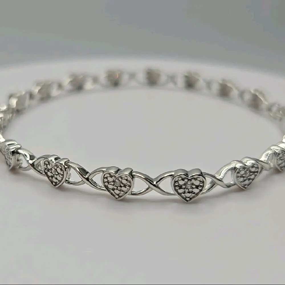 Sterling silver heart bracelet with natural diamonds in the center