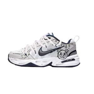 Nike Air Monarch 4 Custom Sneakers: Deconstructed Graffiti Low-Top Dad Shoes for Men and Women with Slip-Resistant Durability in Gray-White Trending Shoes, House White Official Shoes to Get / Maison Mihara