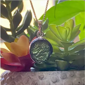 Authentic Moldavite Pendant with Necklace: A 5.1 grams genuine celestial gem, verified for authenticity. Embrace cosmic energies, deepen your spiritual connection, and leap to a transformation journey. Elevate your style and consciousness now.