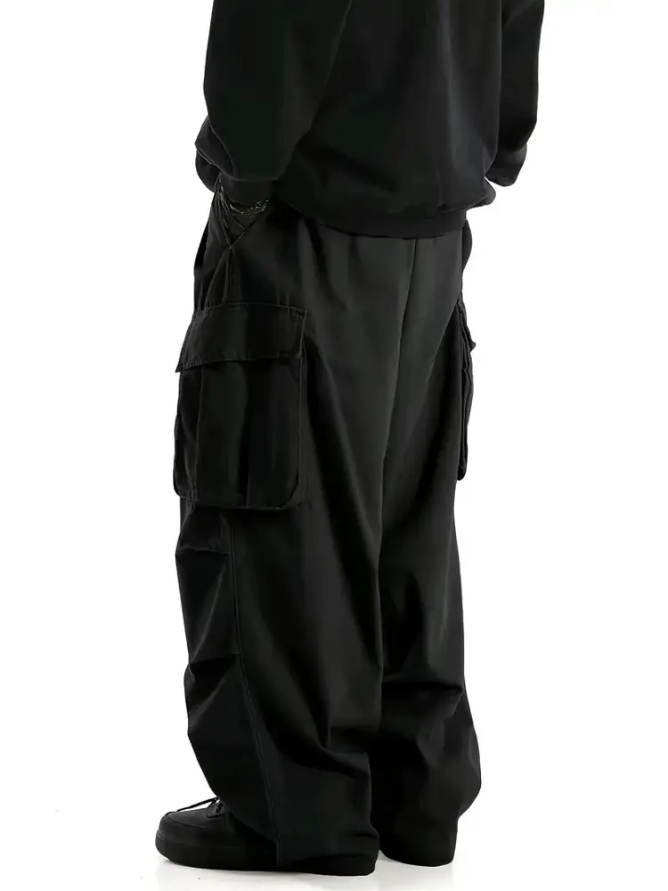 Single piece American-style wide-leg cargo pants with multiple pockets, available in three colors, featuring a drawstring, high waist, drapey loose fit, floor-length functional casual long pants. Unisex design; sold individually as one item.