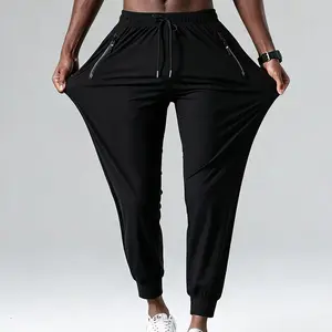 Men’s high-quality plus-size ice silk cool-touch jogger pants with four-way stretch, elastic waistband with drawstring; elastic band design with zippered pockets; thin, highly stretchy quick-dry fitness pants made from skin-friendly, smooth, soft fabric—i