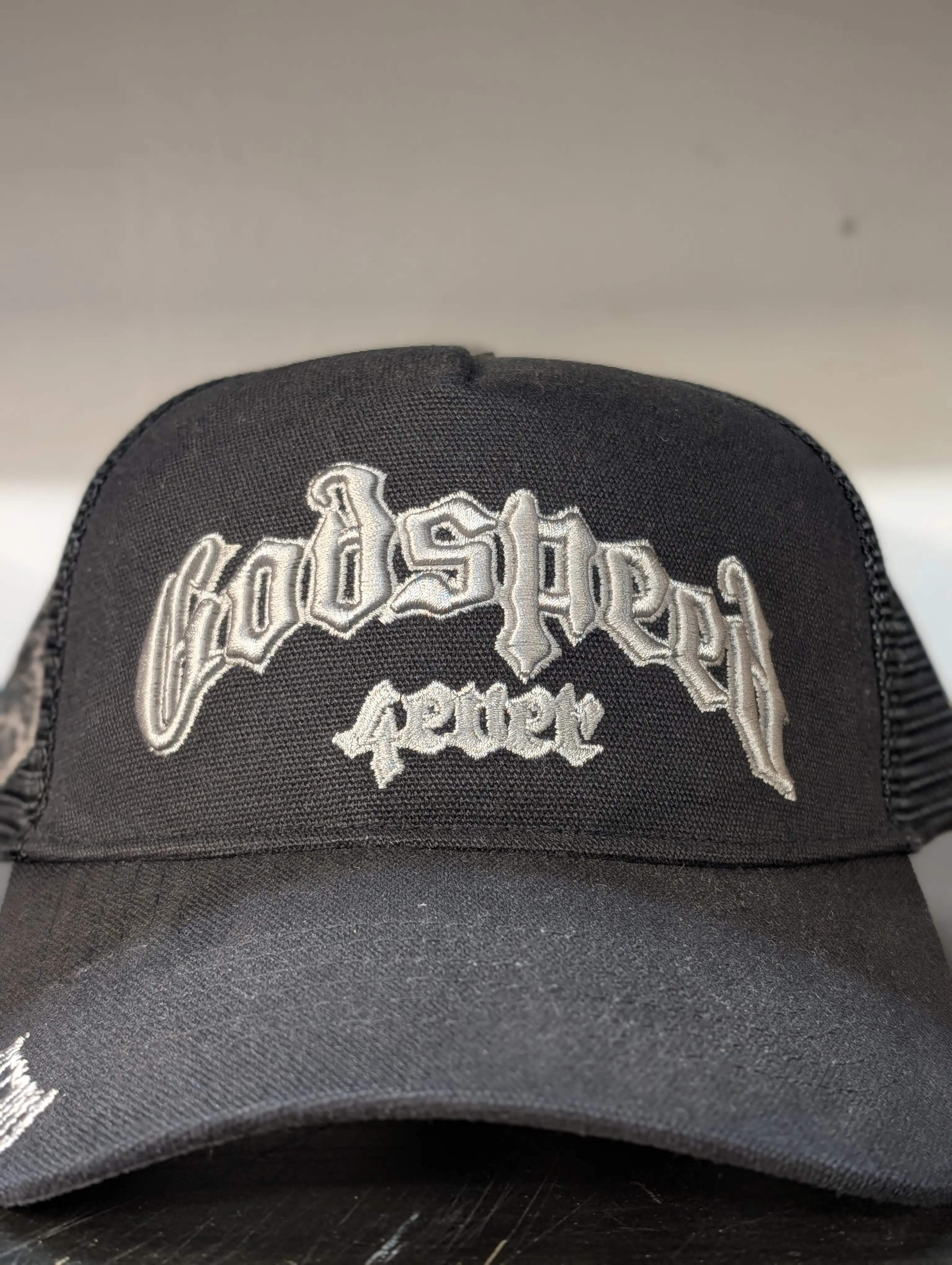 Godspeed Forever Black Trucker Hat with Embroidered Logo and Mesh Back