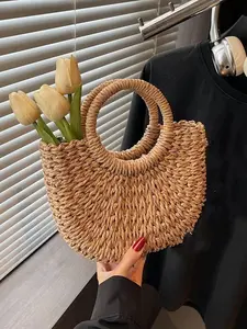Simple holiday style beige hand-woven semi-circular straw bag, Crescent bag, retro ring handbag, Handheld bag purse, niche design beach travel all-match handbag, compact and versatile, suitable for daily travel, vacation travel, etc.