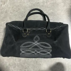 Black Woman’s Bag with Unique White Stitching