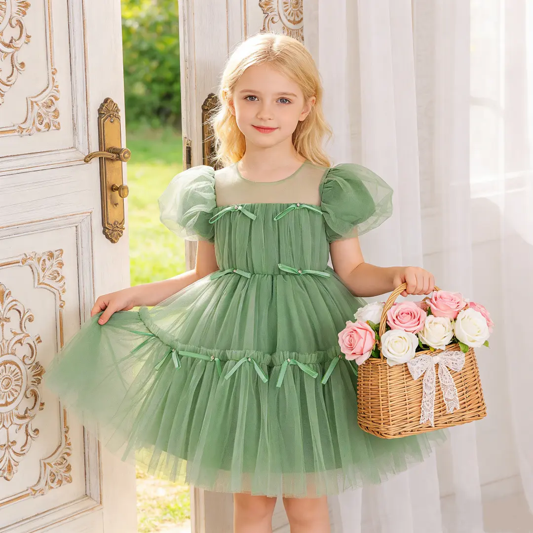 6130 Children's formal dress princess style gown for older girls featuring puff sleeves bowknot and mesh fabric suitable for performances and special occasions.