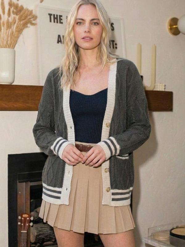 Preppy Cable Knit Varsity Cardigan  Textured cable knit cardigan with contrast varsity-inspired trim.