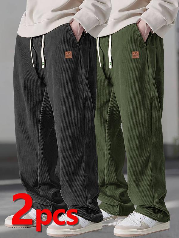 Two men's autumn casual pants featuring a simple and versatile style with drawstring design, adding a casual feel. The pants have delicate small details, such as stitching accents, making them comfortable and stylish. The loose fit provides comfort and fr