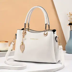 Elegant Wo 's Handbag with Detachable Shoulder Strap, Golden-Tone Hardware & Chic Leaf Charm - Stylish White Satchel for Everyday Use, Casual Chic Bag |   Stylish Charm Handbag |   Bag