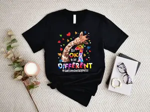 Giraffe With Puzzle Pieces And Hearts Print Ok To Be Different Autism Awareness T Shirt Casual Loose Fit Women's Top For Everyday Wear And Special Occasions