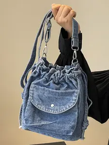 Retro distressed denim drawstring bucket messenger bag, three-dimensional front pocket metal buckle design, adjustable shoulder strap crossbody messenger bag, personalized creative niche suitable for daily travel, shopping, etc.