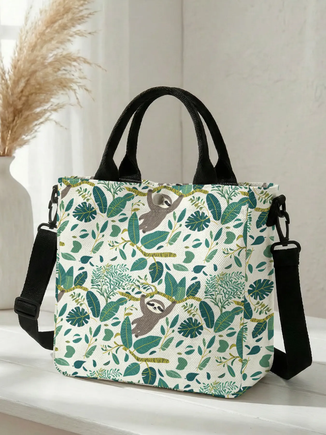 1 piece of 2D printed fashion crossbody bag with a sloth and greenery pattern, adjustable shoulder strap + snap closure | Students/Office workers/Shopping and going out | A street-ready essential that combines style and practicality