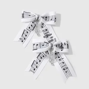 Set of 2 music festival series hair clips: casual, simple, versatile black-and-white line designs featuring sheet music motifs, piano keys, ribbons, lace trim, and bows; duckbill clips and side clips. Suitable for girls’ everyday wear; ideal as a holiday