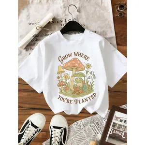"Grow Where You're Planted" Frog Mushroom Graphic Oversized T-Shirt, Cute Cottagecore Nature Tee,Retro "Grow Where You're Planted" Oversized T-Shirt, Cute Frog Reading Mushroom Daisy Graphic Tee