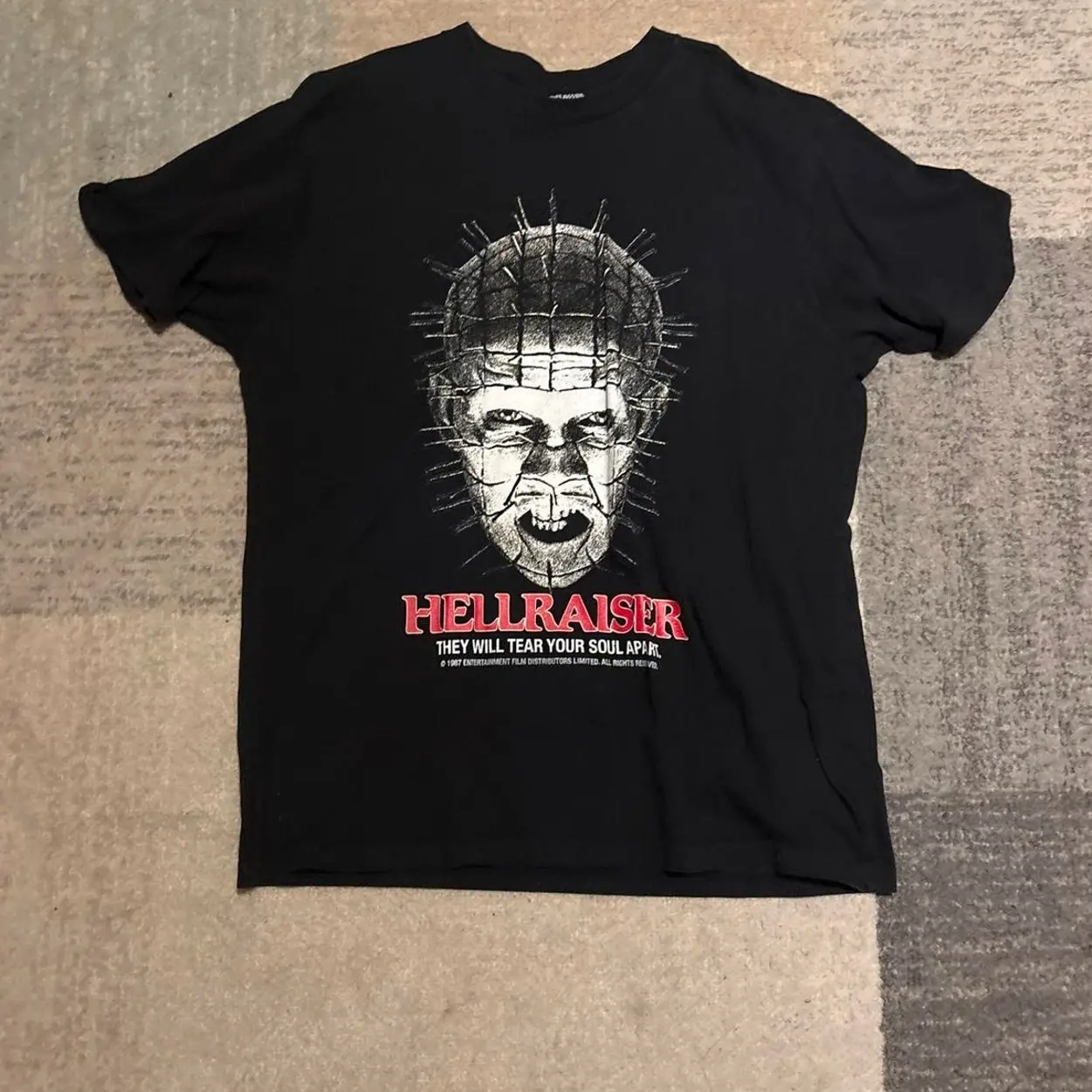 Hellraiser Pinhead black t-shirt with graphic of a man's face with pins and the words 'HELLRAISER' and 'THEY WILL TEAR YOUR SOUL APART' #horror #pinhead