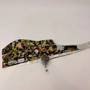 Scrub cap and badge reel