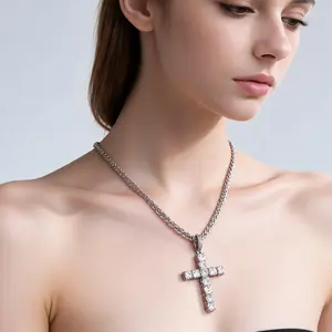Latin cross design, fully paved with cubic zirconia, thick rope chain; a blend of street style and elements of faith.